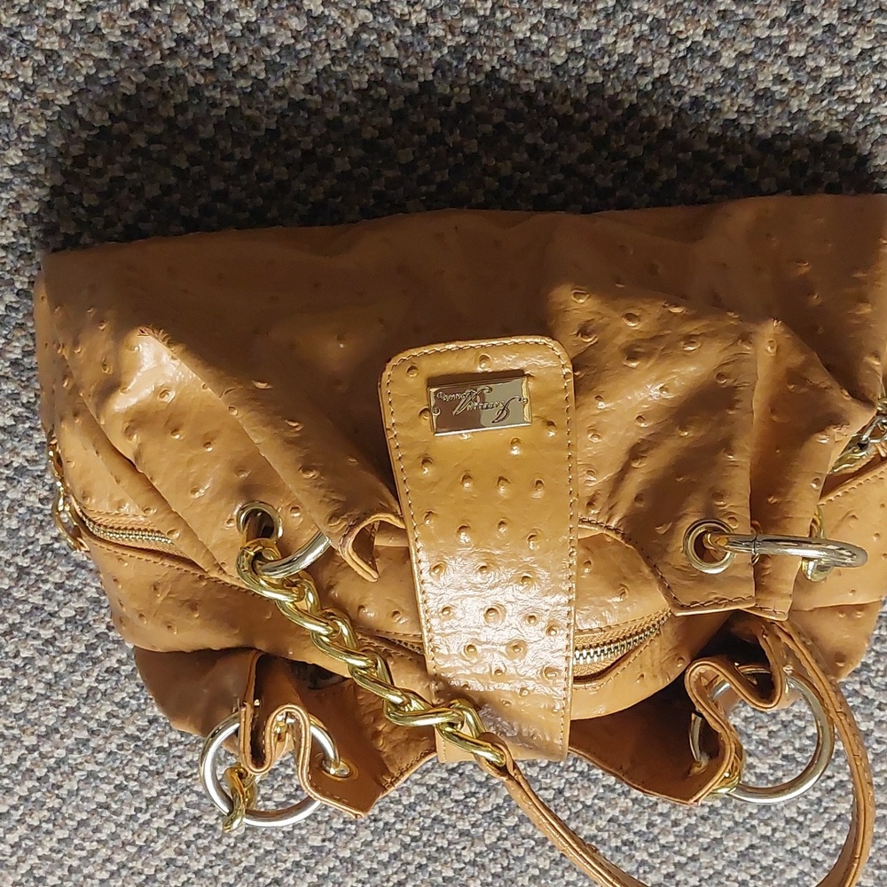 Isabella Adams Ostrich handbag - not exactly tan, has an orange/yellow hue.